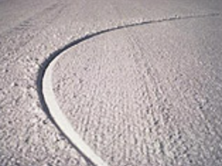 A perfectly round, pencil-thin trench in the snow