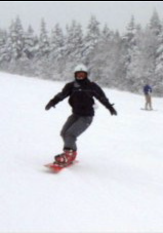 A person on a snowboard