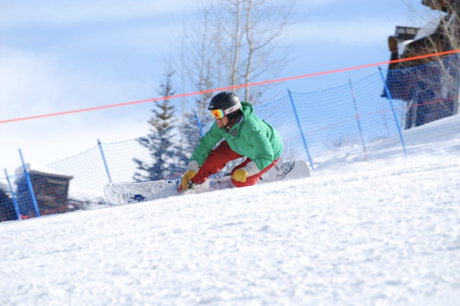 snowboarder carving on toeside edge